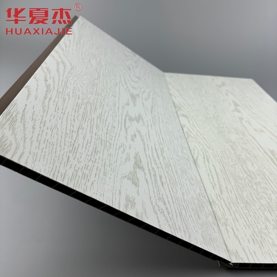 El panel de pared de PVC blanco laminado más vendido panel de decoración de techo de PVC de grano de madera simulado para apartamento