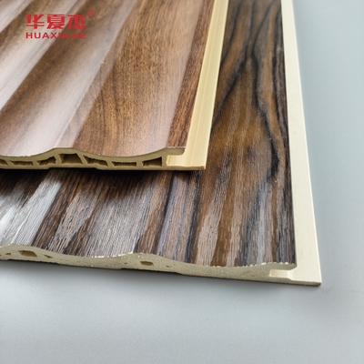 Precio de fábrica al por mayor Grano de madera Panel de pared de Wpc fluido Decoración interior de la casa