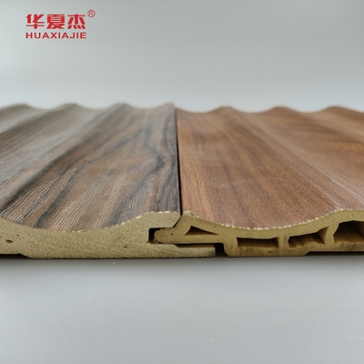 Precio de fábrica al por mayor Grano de madera Panel de pared de Wpc fluido Decoración interior de la casa