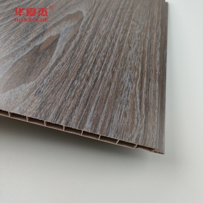 Venta al por mayor Panel de pared de madera oscura de grano de PVC resistente a la humedad Panel de techo de PVC Decoración de oficina