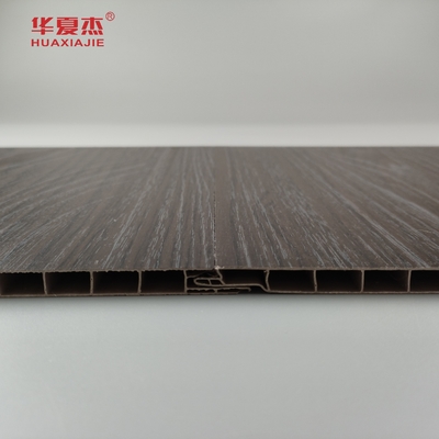 Venta al por mayor Panel de pared de madera oscura de grano de PVC resistente a la humedad Panel de techo de PVC Decoración de oficina