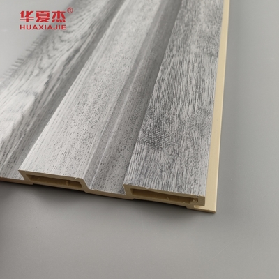 En general, el diseño de la madera gris de paneles Wpc de fluido para decoraciones de paredes para el hogar