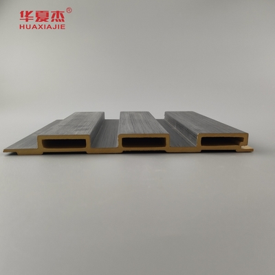 Nuevo producto Panel de pared laminado de madera de grano de Wpc Panel de pared laminado de madera de grano de madera de Wpc Instalar fácilmente decoración de paredes interiores