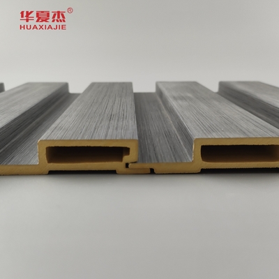 Nuevo producto Panel de pared laminado de madera de grano de Wpc Panel de pared laminado de madera de grano de madera de Wpc Instalar fácilmente decoración de paredes interiores