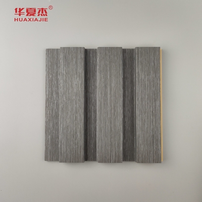 Nuevo producto Panel de pared laminado de madera de grano de Wpc Panel de pared laminado de madera de grano de madera de Wpc Instalar fácilmente decoración de paredes interiores