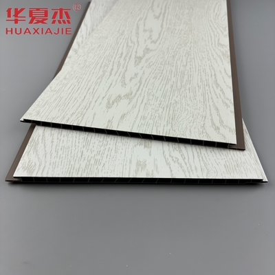 El panel de pared de PVC blanco laminado más vendido panel de decoración de techo de PVC de grano de madera simulado para apartamento
